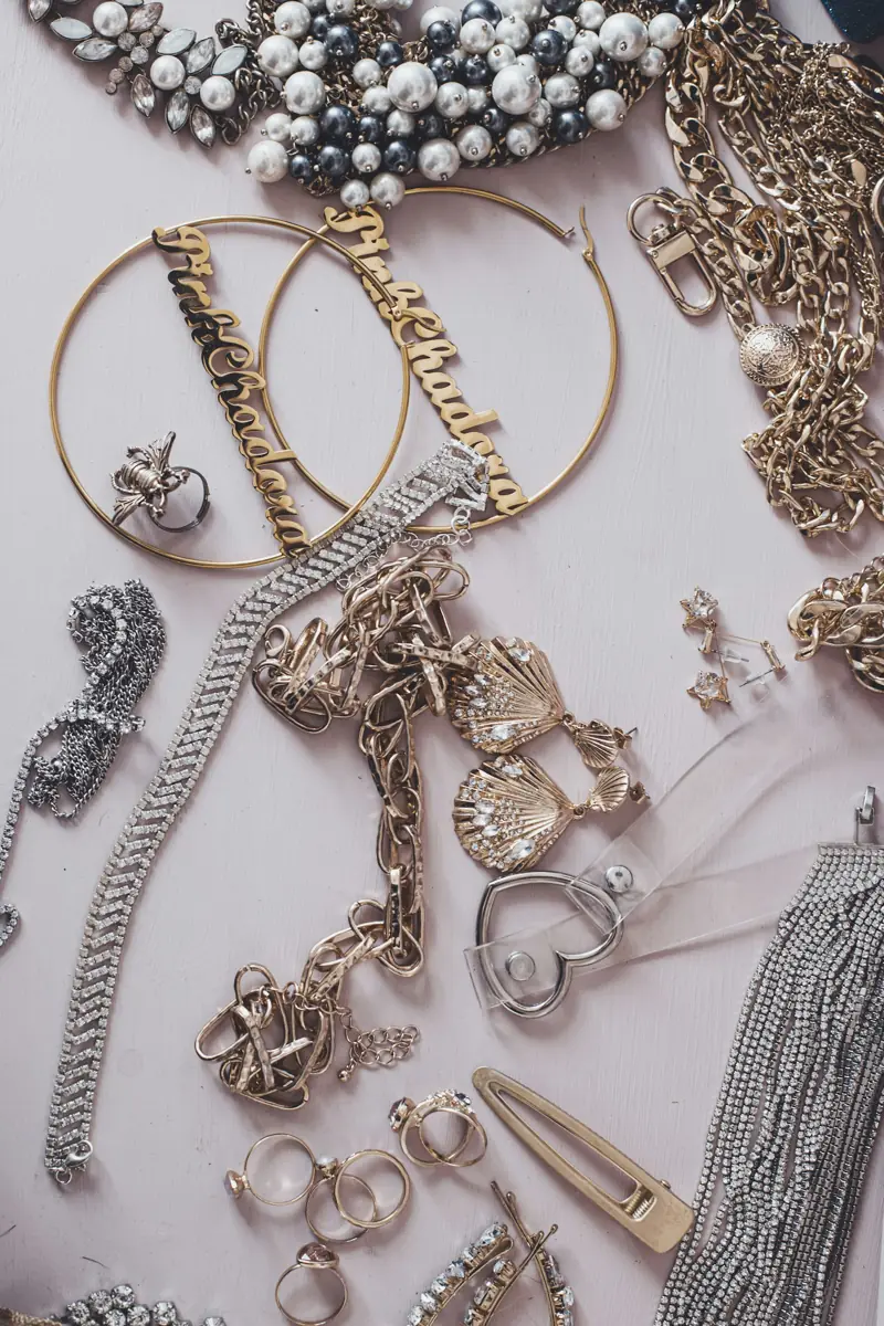 Gold and silver jewellery components laid out on the workbench